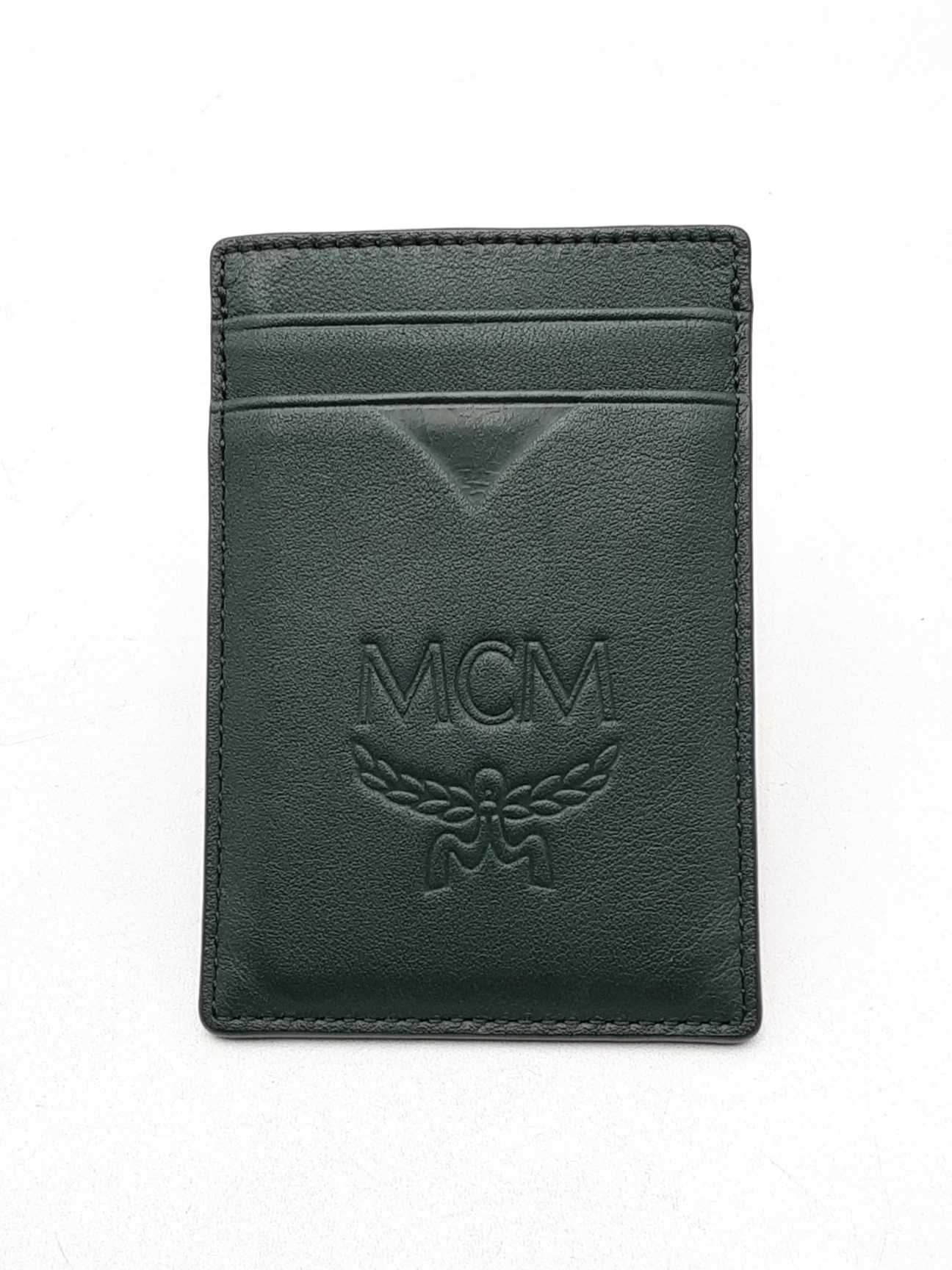 [MCM]★韓国人気★Aren Embossed Leather Half-Wallet MCM Aren Monogram Embossed Crossbody Wallet in Brown | Lyst