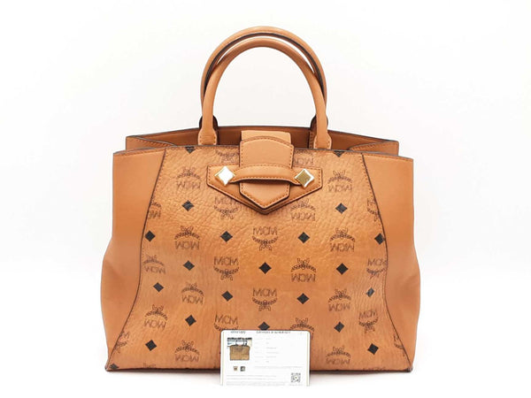 Mcm Essential Medium Tote Bag In Cognac Visetos Coated Canvas Fw0525ozxdu