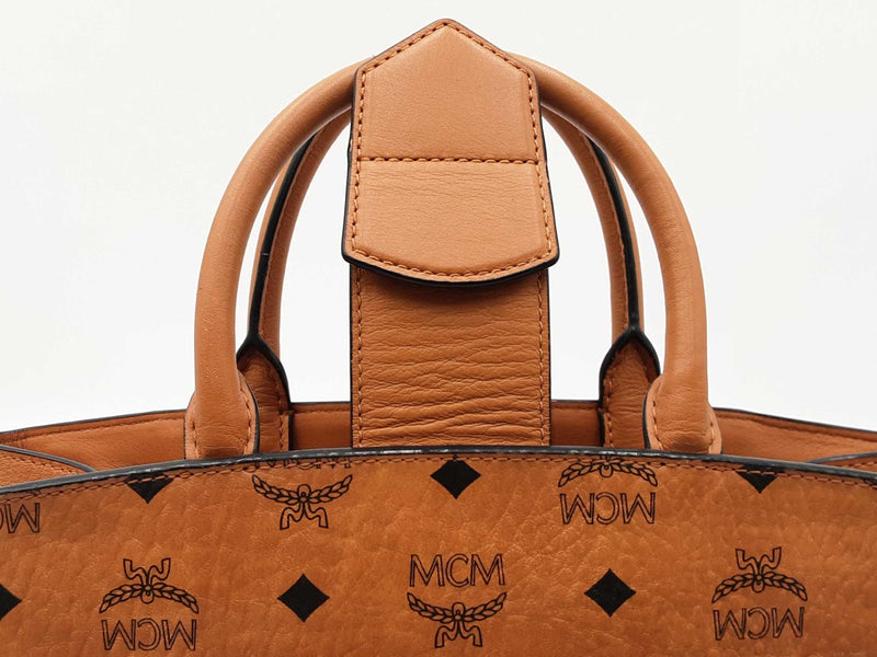Mcm Essential Medium Tote Bag In Cognac Visetos Coated Canvas Fw0525ozxdu