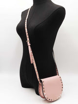 Valentino Garavani Rockstud Mini Saddle Bag In Pink Grained Leather Fw1225oxzdu