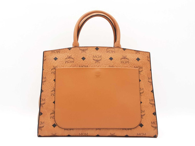 Mcm Essential Medium Tote Bag In Cognac Visetos Coated Canvas Fw0525ozxdu