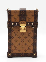 Louis Vuitton Pochette Trunk Verticale In Reverse Monogram Coated Canvas Fw0626loxzdu