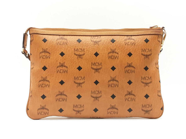 Mcm Stark Wristlet Pouch In Cognac Visetos Coated Canvas Fw0425lrzdu