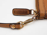 Mcm Stark Wristlet Pouch In Cognac Visetos Coated Canvas Fw0425lrzdu