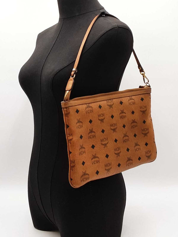Mcm Stark Wristlet Pouch In Cognac Visetos Coated Canvas Fw0425lrzdu