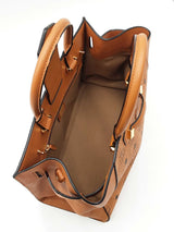 Mcm Essential Medium Tote Bag In Cognac Visetos Coated Canvas Fw0525ozxdu