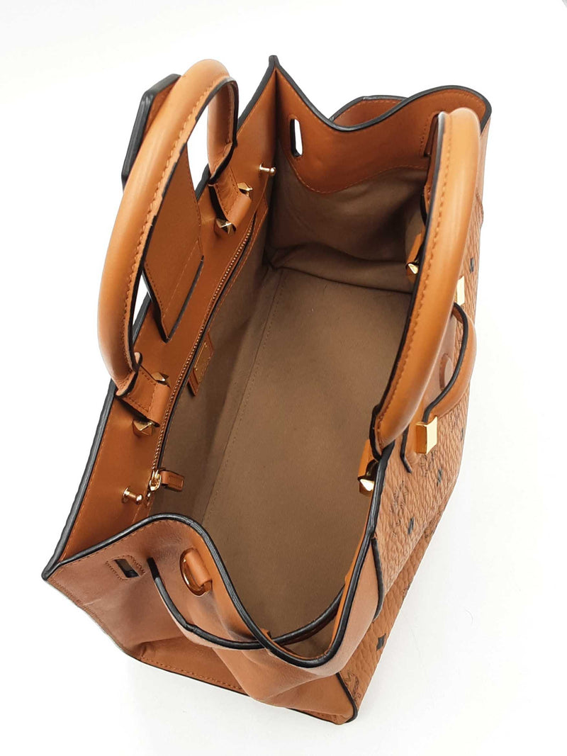 Mcm Essential Medium Tote Bag In Cognac Visetos Coated Canvas Fw0525ozxdu