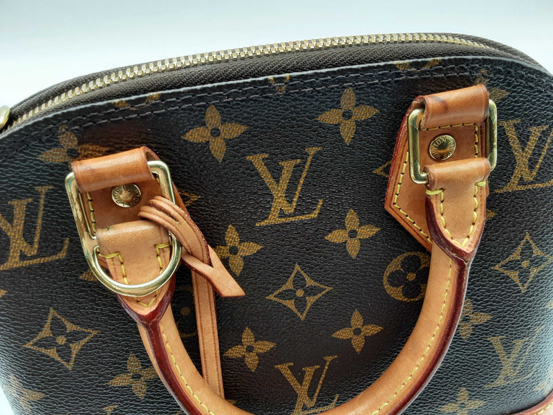 Louis Vuitton Alma Brown Monogram Coated Canvas Crossbody Bag Do0125wxzde