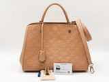 Louis Vuitton Montaigne Handbag In Beige Monogram Empreinte Leather Fw0926cexdu