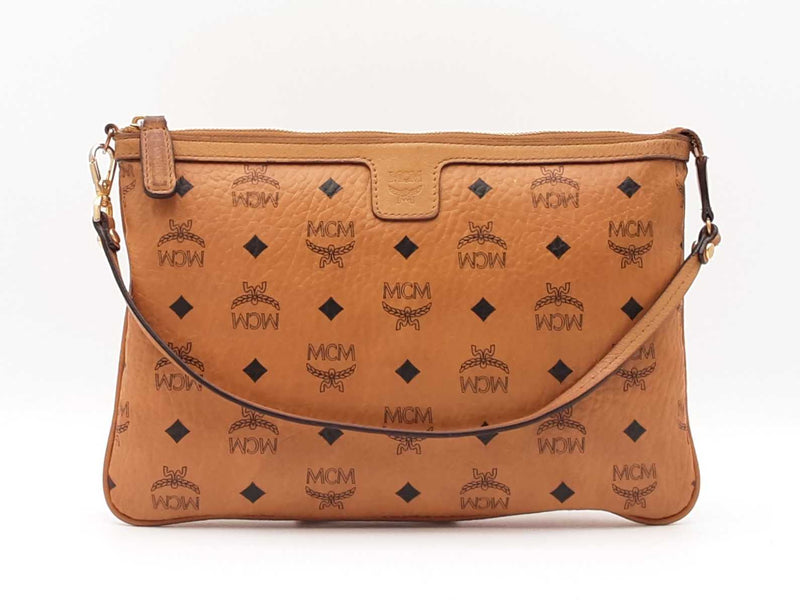 Mcm Stark Wristlet Pouch In Cognac Visetos Coated Canvas Fw0425lrzdu