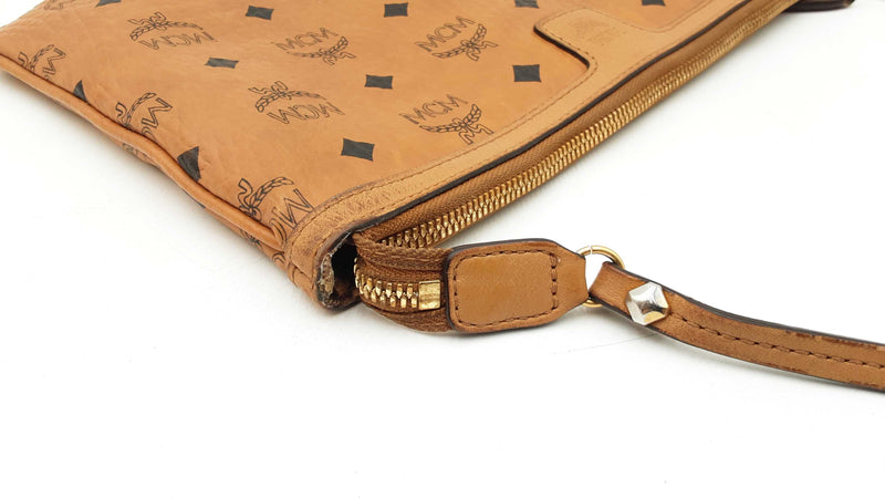 Mcm Stark Wristlet Pouch In Cognac Visetos Coated Canvas Fw0425lrzdu